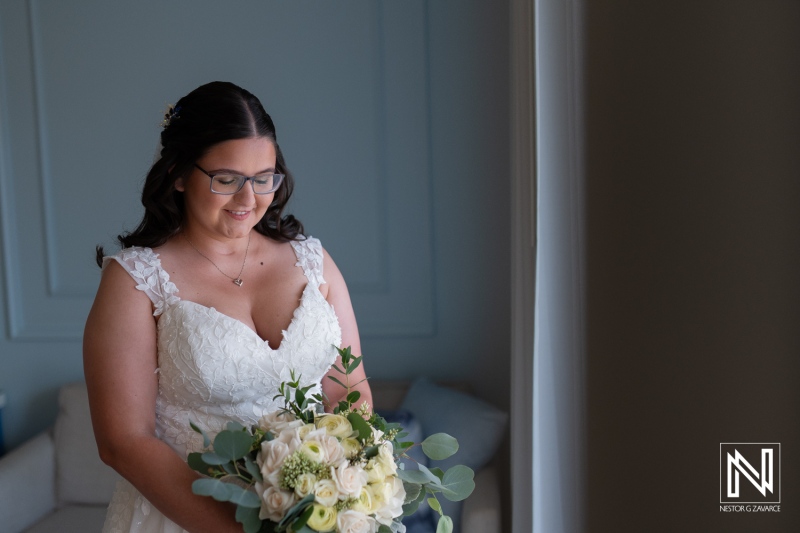 Bride prepares for wedding at Renaissance Wind Creek Curacao Resort in beautiful tropical setting