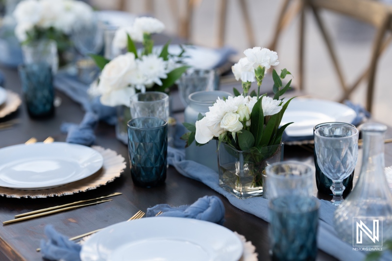 Beautifully arranged wedding table setup at Renaissance Wind Creek Curacao Resort in Curacao during a sunny day