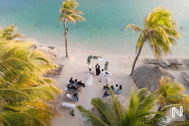 Ceremony on the beach at Renaissance Wind Creek Curacao Resort with tropical backdrop and serene waters