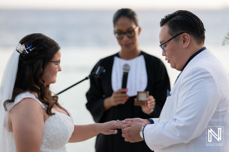 Romantic wedding ceremony at Renaissance Wind Creek Curacao Resort with ocean backdrop and emotional vows exchanged