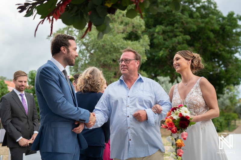 Father gives hand of the bride