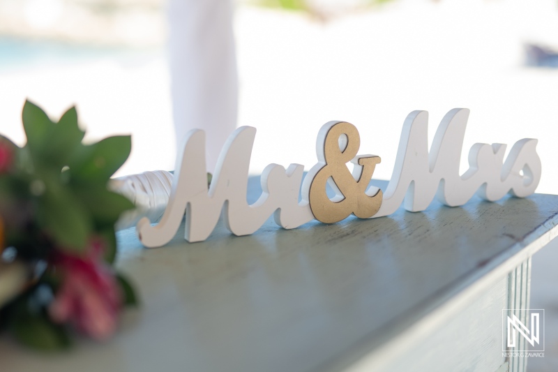 Elegant Mr and Mrs sign at a wedding celebration in Daaibooi, Curacao, capturing the romantic atmosphere and beautiful setting during the ceremony