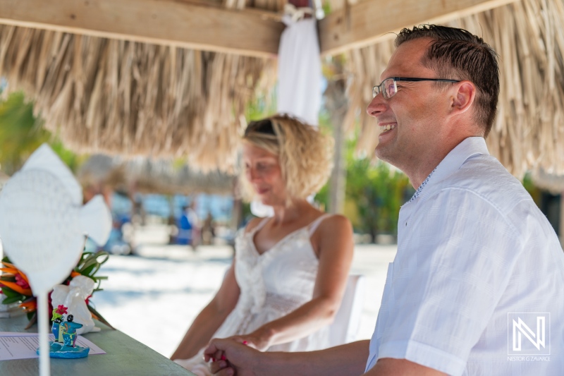 A Couple Enjoys a Joyful Moment at a Beachside Bar During Sunset, Capturing the Essence of a Tropical Getaway Filled With Laughter and Relaxation