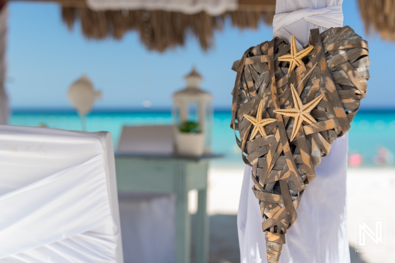 Decorative Beach Heart With Starfish Accents at a Seaside Location, Surrounded by Soft Sands and Clear Blue Waters, Creating a Tranquil and Artistic Atmosphere During Daylight