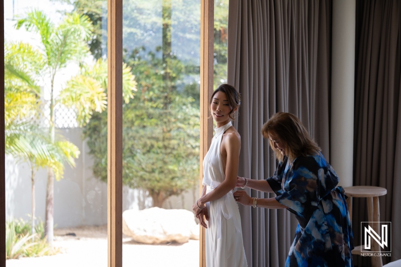 Wedding preparations at Playa Hunku in Curacao with bride and her friend getting ready