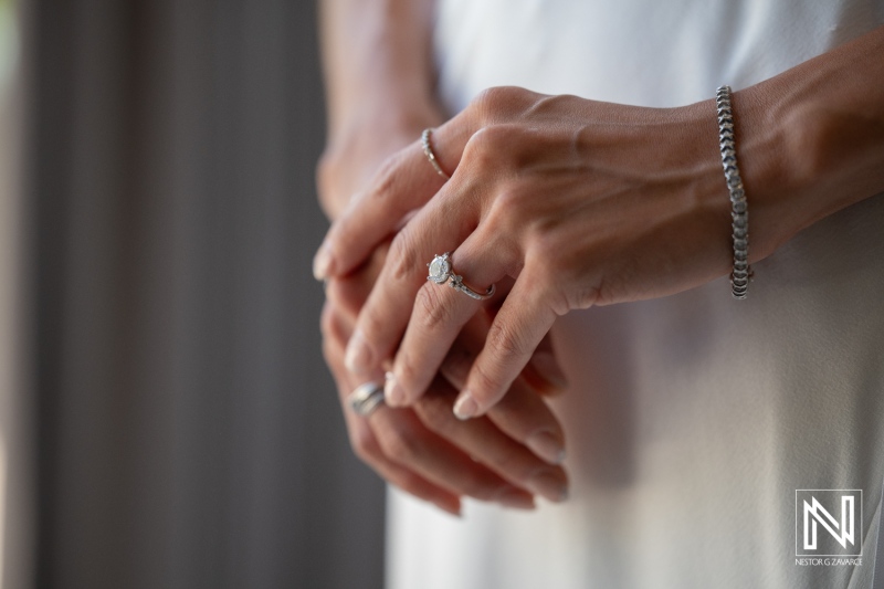 Couple prepares for wedding at Playa Hunku in Curacao with focus on rings and jewelry