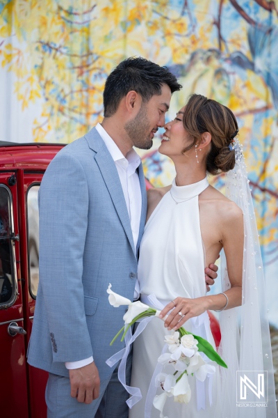 Couple celebrates wedding at Playa Hunku in Curacao surrounded by vivid colors and joyful atmosphere