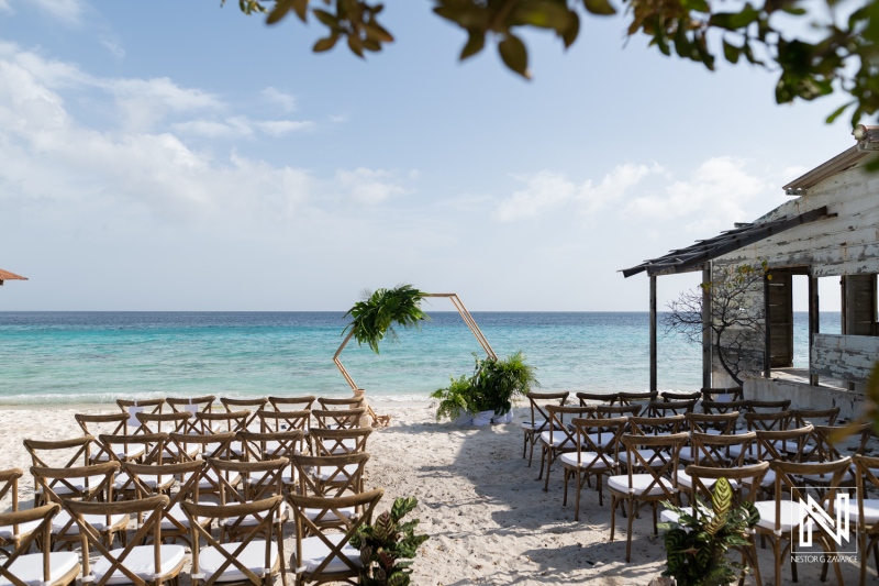 Wedding ceremony setup at Playa Hunku in Curacao near the beach with chairs arranged for guests