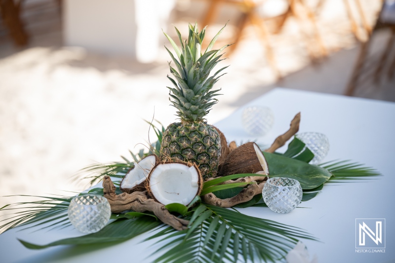 Wedding decorations at Playa Hunku in Curacao with tropical fruits and designs
