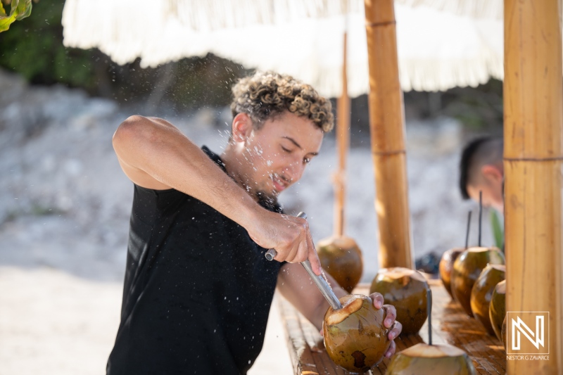 Celebration at Playa Hunku during a wedding with refreshing coconut drinks served
