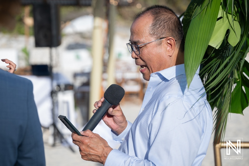Celebration at wedding in Playa Hunku, Curacao with a speaker using a microphone