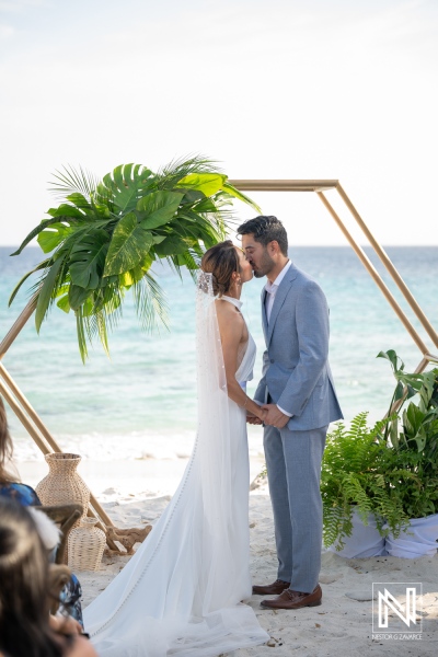 Couple exchanges vows at a wedding ceremony in Playa Hunku, Curacao during a sunny day