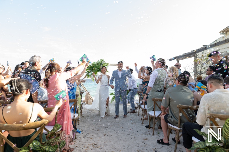 Wedding celebration at Playa Hunku in Curacao with guests enjoying the moment