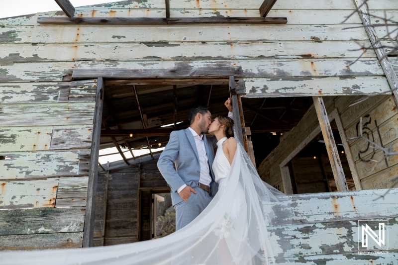 Wedding celebration at Playa Hunku in Curacao with couple sharing a kiss