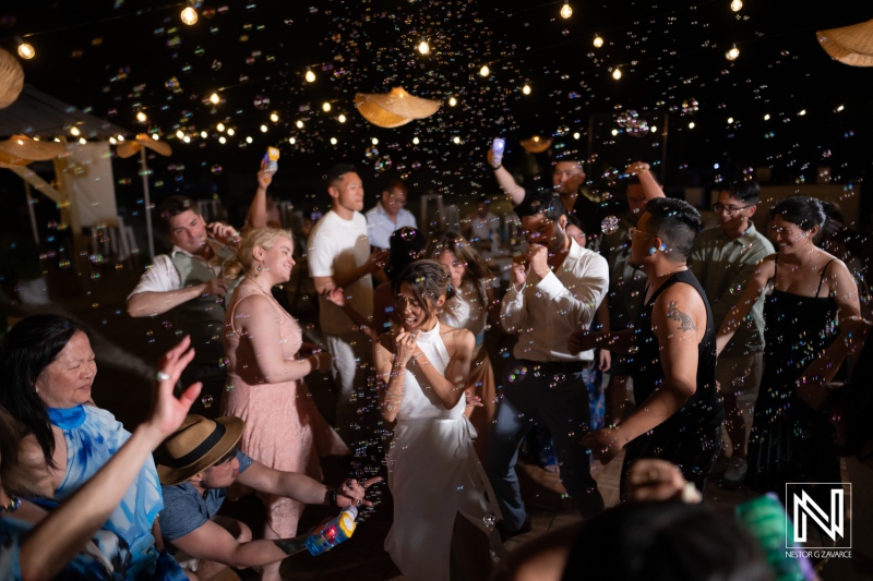Wedding celebration at Playa Hunku in Curacao with dancing and bubbles