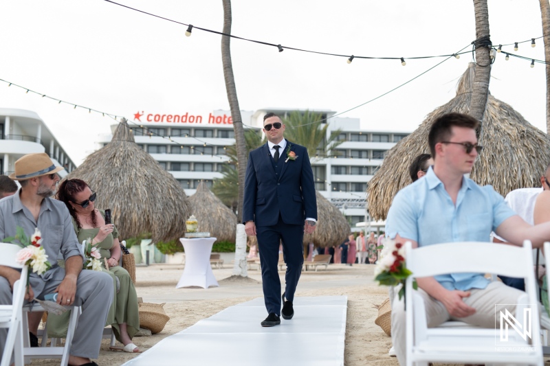 Groom walking down the aisle