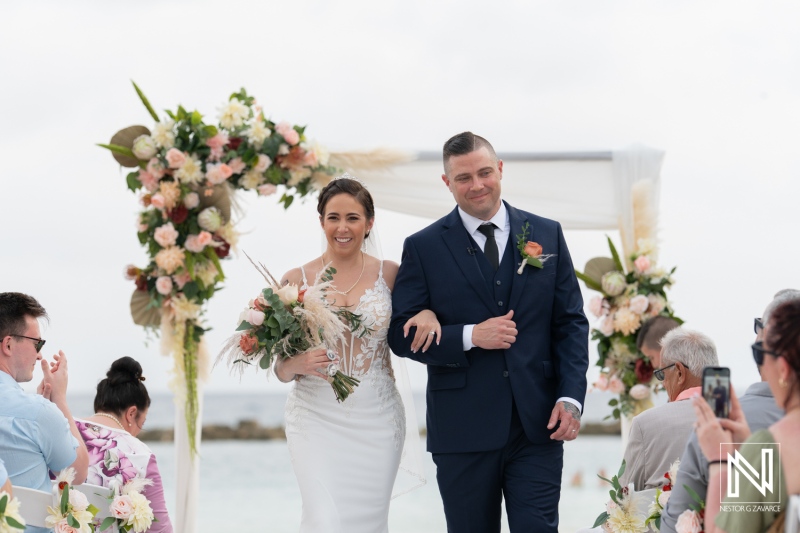 Bride and groom walking down the aisle