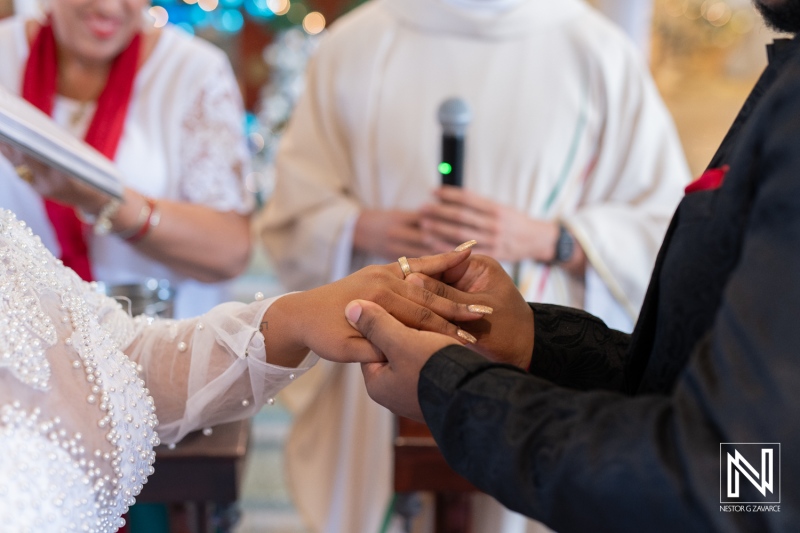 Ceremony showcasing a couple exchanging vows during their wedding in Curacao with a festive atmosphere