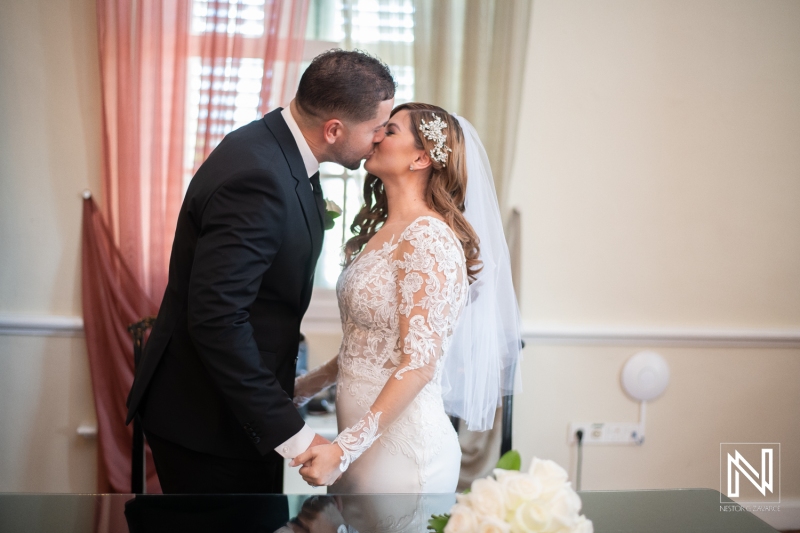 Bride and groom first kiss