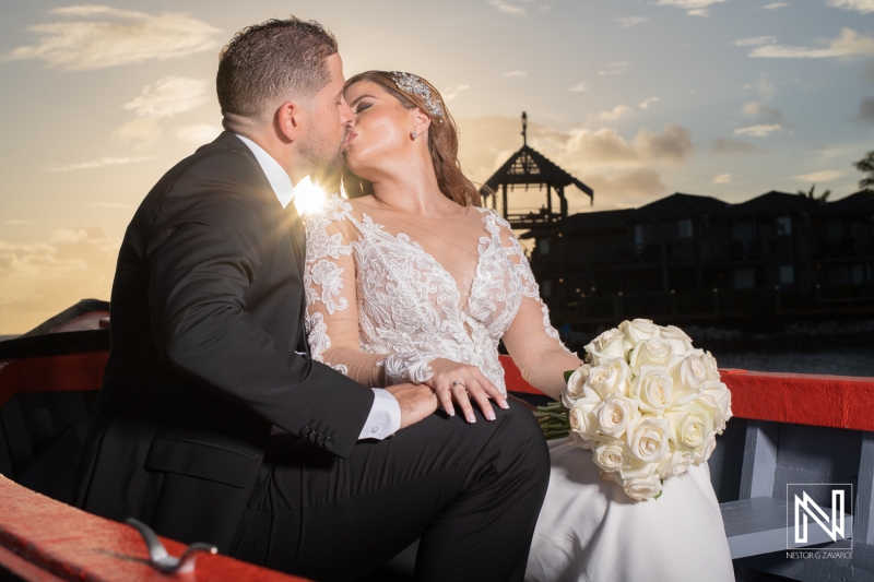 Sunset shot with bride and groom kissing