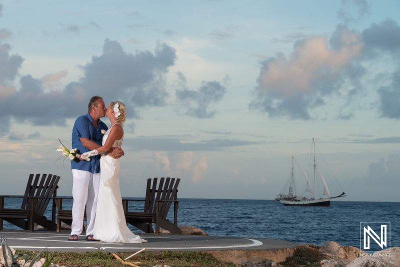 Bride and groom sunset photoshoot  whit sailboat