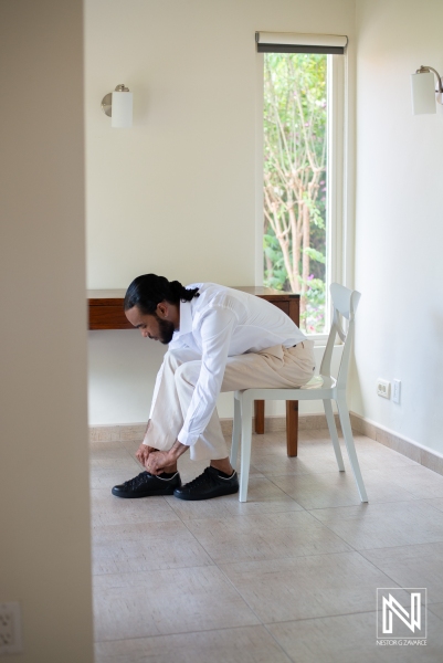 Groom getting dressed