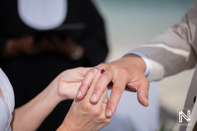 Wedding ceremony at Daaibooi Beach in Curacao with ring exchange during the event