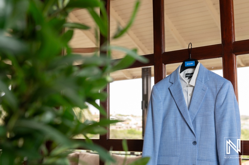 Elegant wedding attire preparation at Kokomo Beach in Curacao showcases exquisite style for a memorable celebration