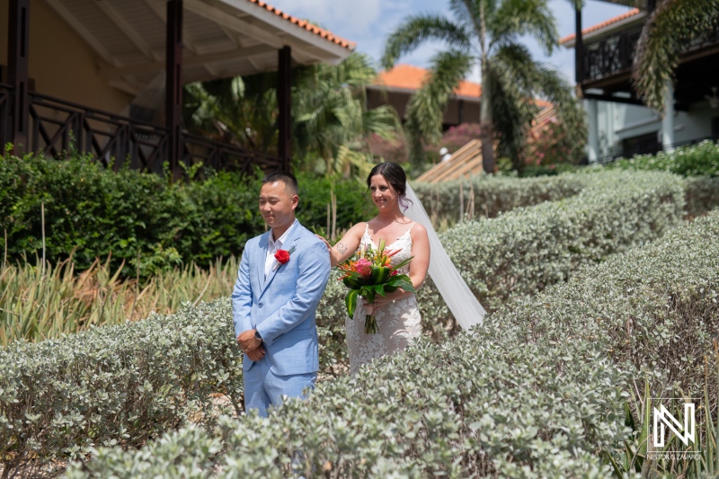 Wedding ceremony at Kokomo Beach provides a stunning backdrop in Curacao for a heartfelt exchange of vows in tropical paradise