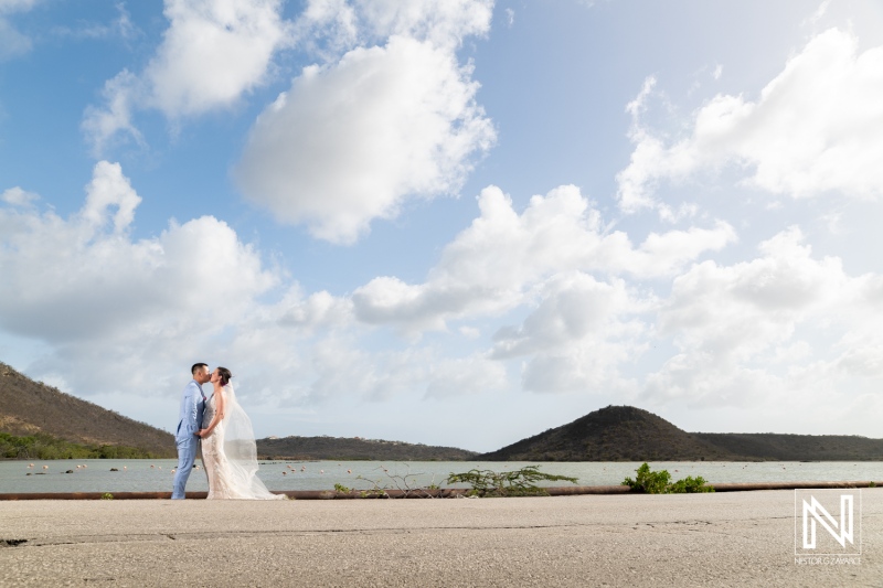 Couple enjoys a romantic moment on Kokomo Beach during their wedding ceremony in Curacao