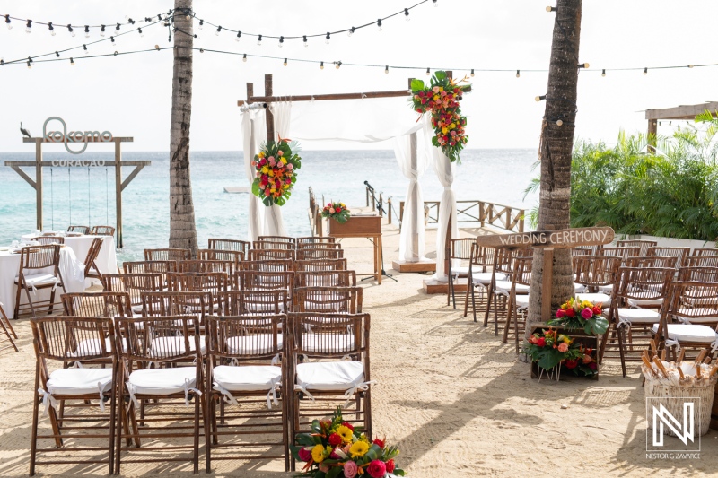 Stunning wedding setup at Kokomo Beach Curacao featuring beautiful floral arrangements and an ocean view for a romantic ceremony