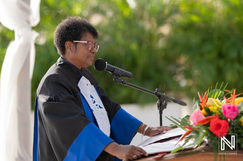 Celebration of love at Kokomo Beach wedding in Curacao featuring heartfelt vows and a beautiful floral arrangement