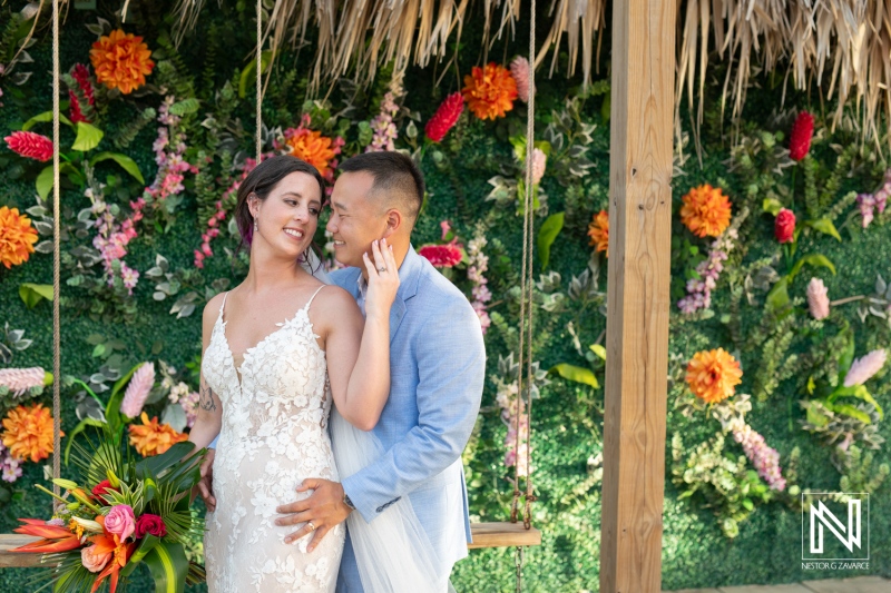 Couple shares intimate moment at a beautiful wedding ceremony on Kokomo Beach in Curacao during a sunny day