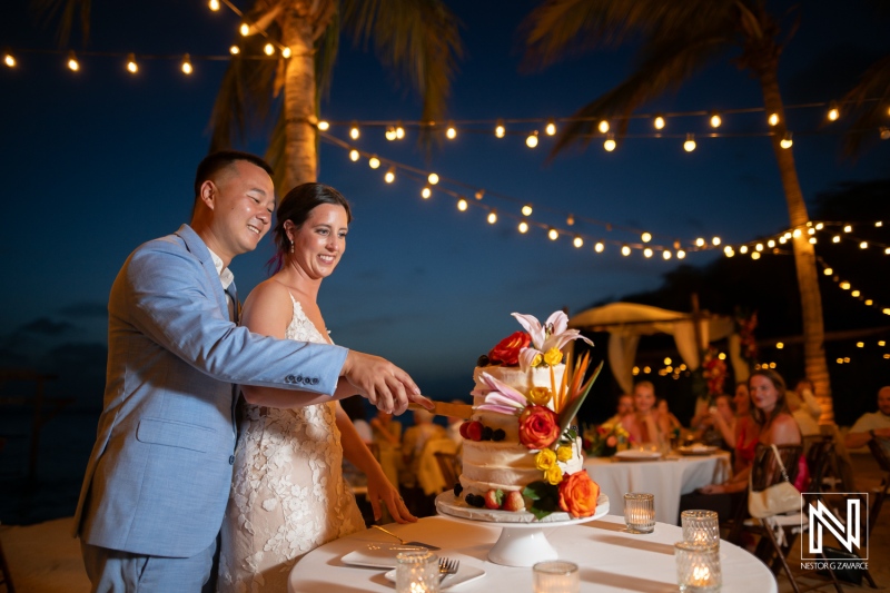 Sweet celebration of love during a beautiful wedding reception at Kokomo Beach in Curacao with a stunning sunset ambiance