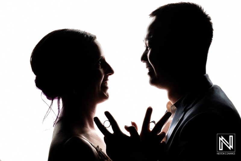 Couple shares joyful moment and wedding vows at Kokomo Beach in Curacao as they celebrate their love against a bright backdrop