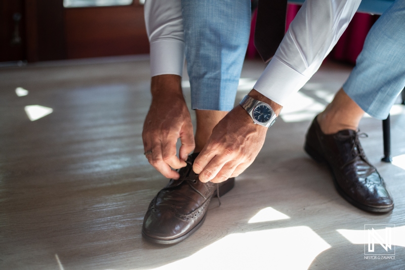 Groom getting dressed