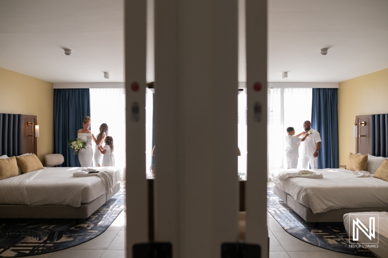 Two hotel rooms in a modern setting with a family preparing for an event, illuminated by natural light during the daytime