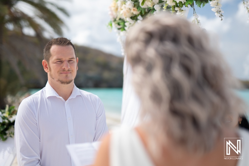 Wedding ceremony at Cas Abao Beach in Curacao takes place with couple exchanging vows by the sea