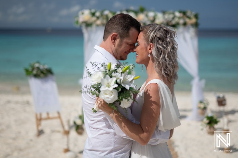 Wedding ceremony at Cas Abao Beach in Curacao with couple sharing a moment