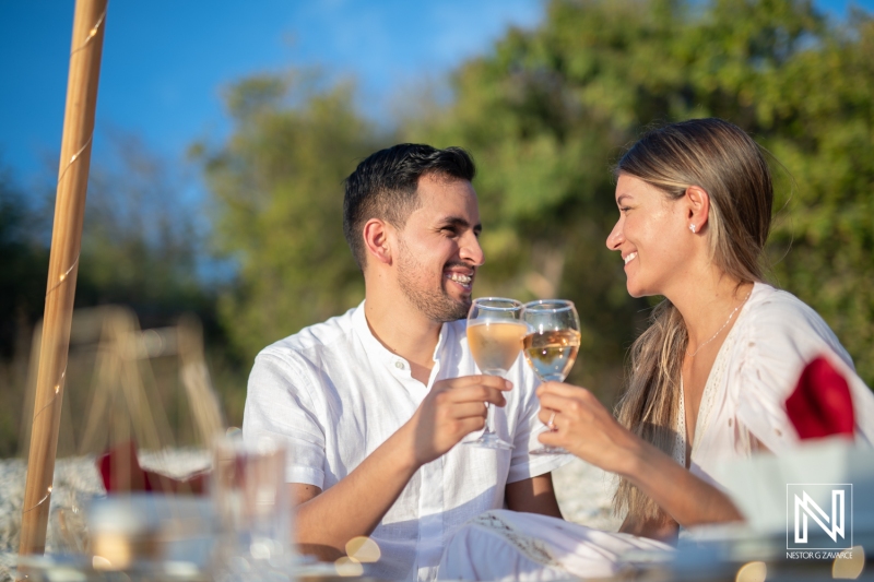 couple wine  toasts at the beach