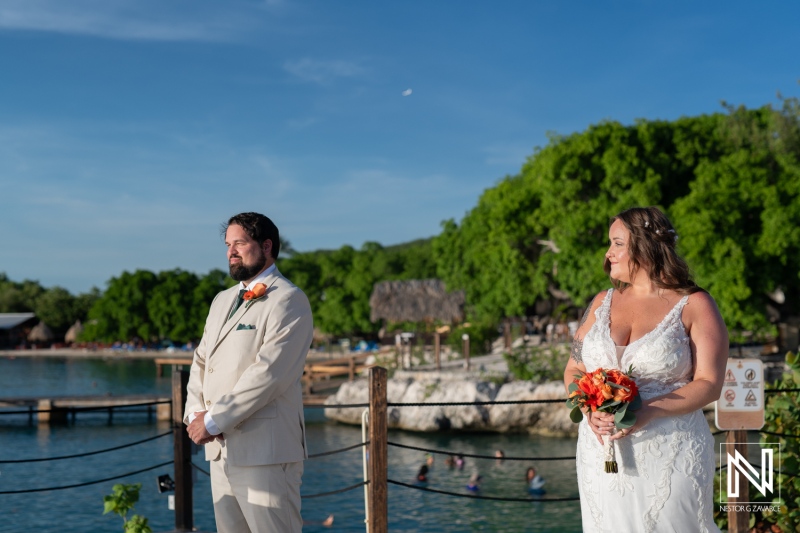 Beautiful wedding ceremony at Dreams Curacao Resort with stunning ocean views and lush greenery