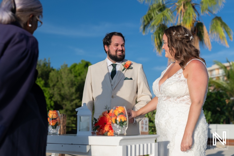 Beautiful wedding ceremony at Dreams Curacao Resort with stunning backdrop and happy couple exchanging vows