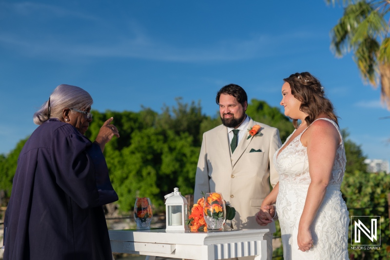 Celebrating love at a beautiful wedding ceremony in Curacao at Dreams Curacao Resort under a clear blue sky