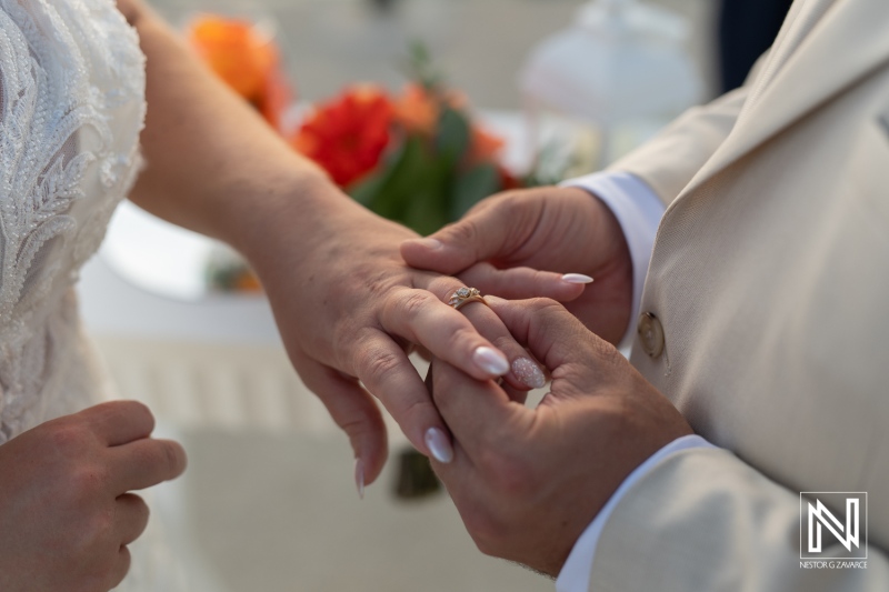 Beautiful wedding ceremony in Curacao at Dreams Curacao Resort with an intimate ring exchange between the bride and groom