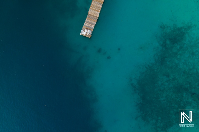 Wedding celebration by the tranquil waters at Dreams Curacao Resort amid scenic Caribbean beauty