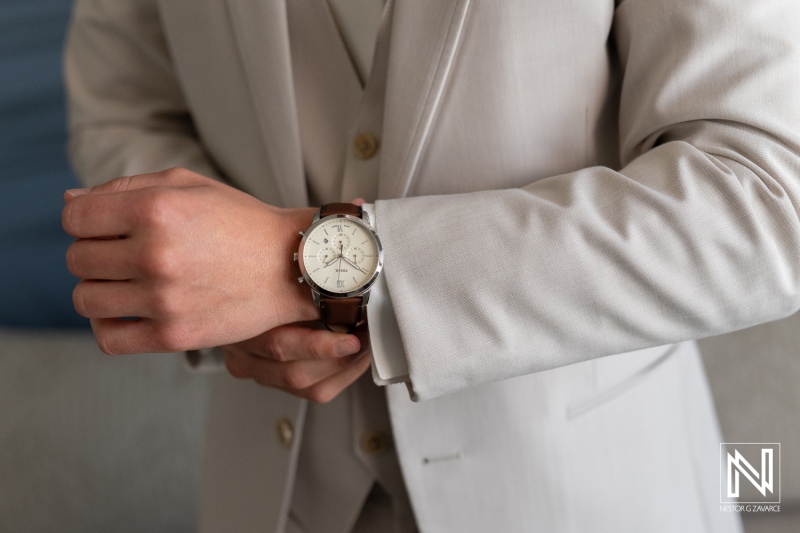 Groom checks his watch before the wedding ceremony at Renaissance Wind Creek Curacao Resort