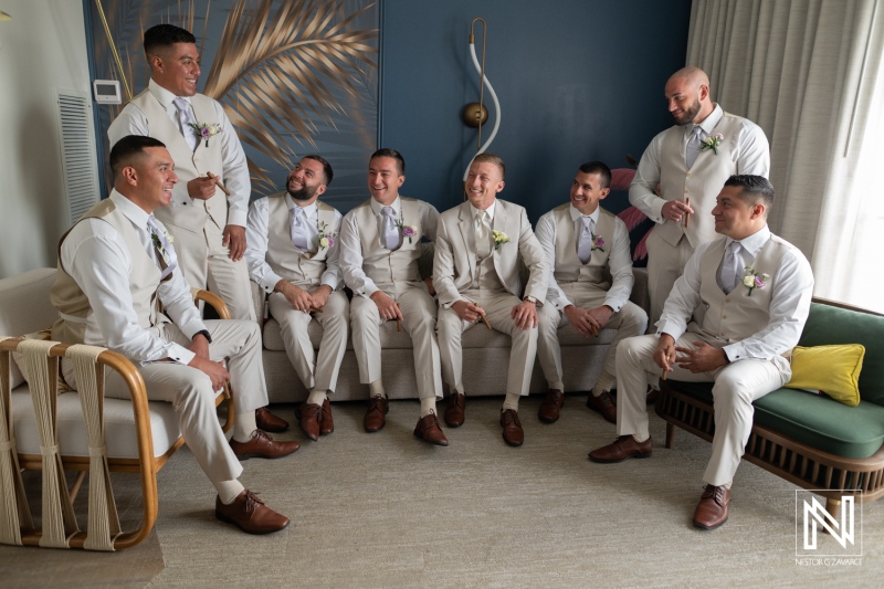 Groom and groomsmen enjoy time together at Renaissance Wind Creek Curacao Resort before wedding ceremony