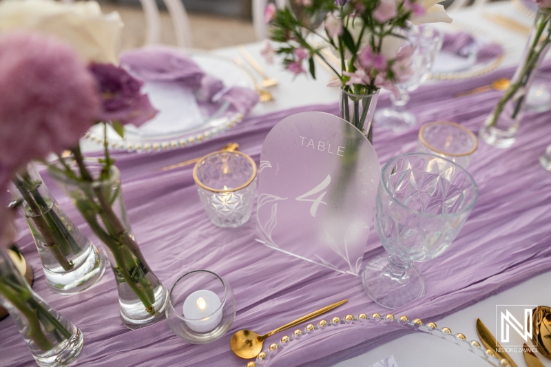 Wedding table setting at Renaissance Wind Creek Curacao Resort with flowers and decorations for special day