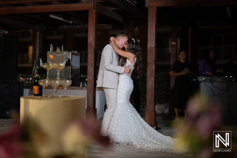 Couple shares a dance during their wedding celebration at Renaissance Wind Creek Curacao Resort