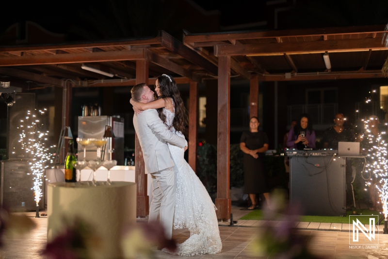 Couple shares first dance at wedding reception in Renaissance Wind Creek Curacao Resort